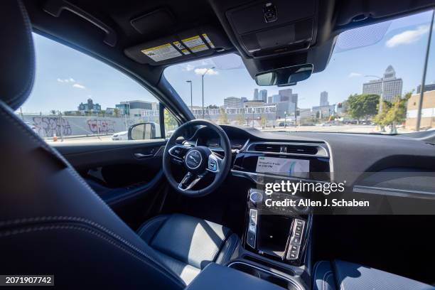 Los Angeles, CA A Waymo robotaxi Jaguar I-PACEs driverless car drives around downtown Los Angeles Monday, March 11, 2024. Waymo is about to announce...