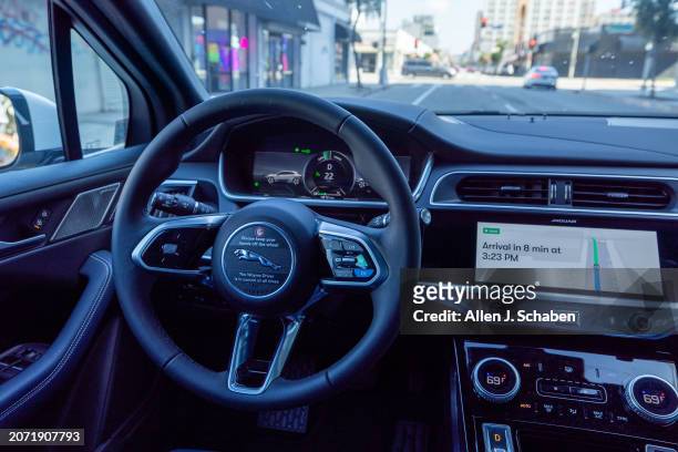 Los Angeles, CA A Waymo robotaxi Jaguar I-PACEs driverless car drives through downtown Los Angeles Monday, March 11, 2024. Waymo is about to announce...