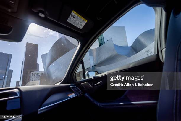 Los Angeles, CA A Waymo robotaxi Jaguar I-PACEs driverless car drives past Walt Disney Concert Hall in downtown Los Angeles Monday, March 11, 2024....