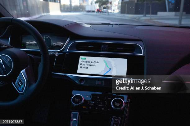Los Angeles, CA A Waymo robotaxi Jaguar I-PACEs driverless car drives through Skid Row in downtown Los Angeles Monday, March 11, 2024. Waymo is about...