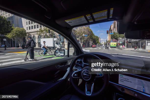 Los Angeles, CA A Waymo robotaxi Jaguar I-PACEs driverless car drives near Skid Row in downtown Los Angeles Monday, March 11, 2024. Waymo is about to...