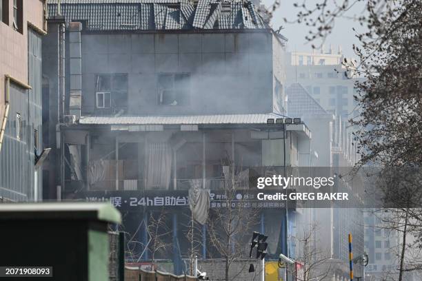 This photo shows a general view of a damaged building at the scene of a suspected gas explosion in Sanhe, in China's northern Hebei province on March...