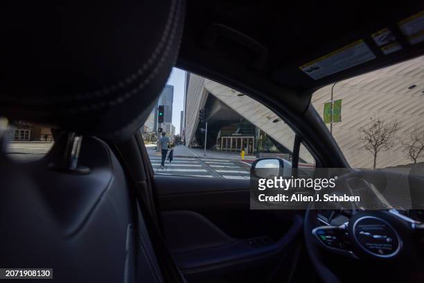 Los Angeles, CA A Waymo robotaxi Jaguar I-PACEs driverless car drives past The Broad in downtown Los Angeles Monday, March 11, 2024. Waymo is about...