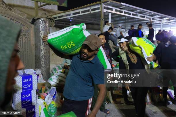 Group of volunteers collects humanitarian aid to be sent to Gaza due to the ongoing Israeli offensive and blockade on Palestinians, in Baghdad, Iraq...