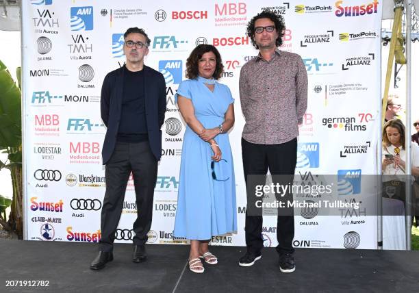 Producer Thanassis Karathanos, director Kaouther Ben Hania and producer Nadim Cheikhrouha address the audience at the 2024 German Oscar Reception at...