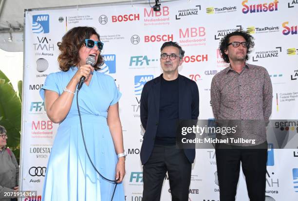Director Kaouther Ben Hania, producer Thanassis Karathanos and producer Nadim Cheikhrouha address the audience at the 2024 German Oscar Reception at...