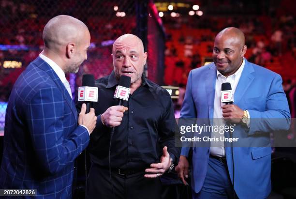 Jon Anik, Joe Rogan, and Daniel Cormier anchor the broadcast during the UFC 299 event at Kaseya Center on March 09, 2024 in Miami, Florida.