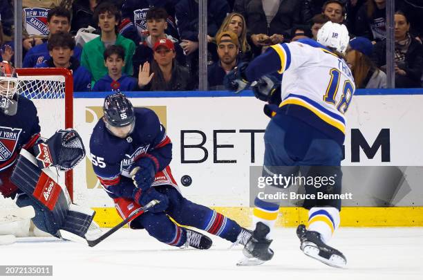 Ryan Lindgren of the New York Rangers blocks a shot by Robert Thomas of the St. Louis Blues during the second period at Madison Square Garden on...