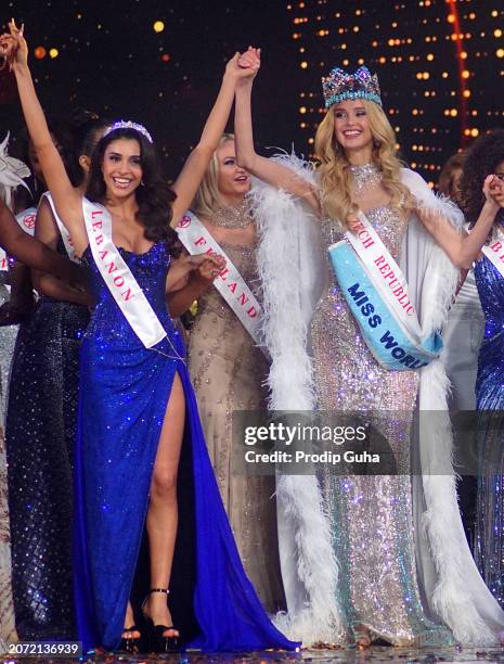 Lebanon's Yasmina Zaytouni and Czech Republic's Miss World winner Krystyna Pyszkova are seen on stage at the Miss World Grand Finale on March 09,...