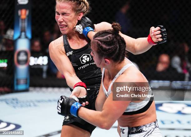 Maycee Barber punches Katlyn Cerminara in a flyweight fight during the UFC 299 event at Kaseya Center on March 09, 2024 in Miami, Florida.