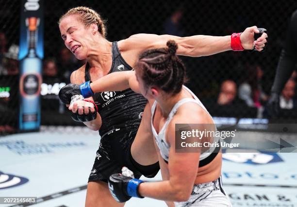 Maycee Barber punches Katlyn Cerminara in a flyweight fight during the UFC 299 event at Kaseya Center on March 09, 2024 in Miami, Florida.