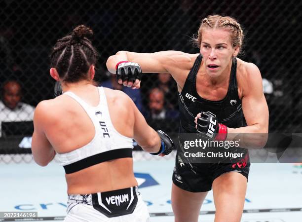 Katlyn Cerminara punches Maycee Barber in a flyweight fight during the UFC 299 event at Kaseya Center on March 09, 2024 in Miami, Florida.