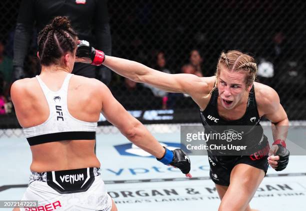 Katlyn Cerminara punches Maycee Barber in a flyweight fight during the UFC 299 event at Kaseya Center on March 09, 2024 in Miami, Florida.