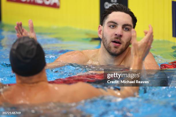 Jack Alexy high fives Caeleb Dressel after winning the Men's 100 Meter Freestyle Final on Day 4 of the TYR Pro Swim Series Westmont at FMC Natatorium...