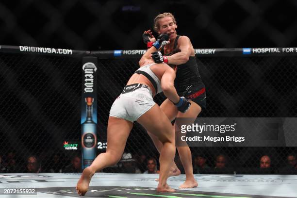 Maycee Barber punches Katlyn Cerminara during their women's flyweight bout at UFC 299 at Kaseya Center on March 09, 2024 in Miami, Florida.