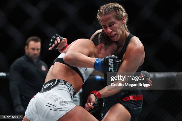 Maycee Barber and Katlyn Cerminara fight during their women's flyweight bout at UFC 299 at Kaseya Center on March 09, 2024 in Miami, Florida.