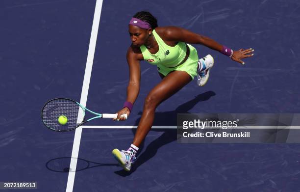 Coco Gauff of the United States plays a forehand volley against Clara Burel of France in their second round match during the BNP Paribas Open at...