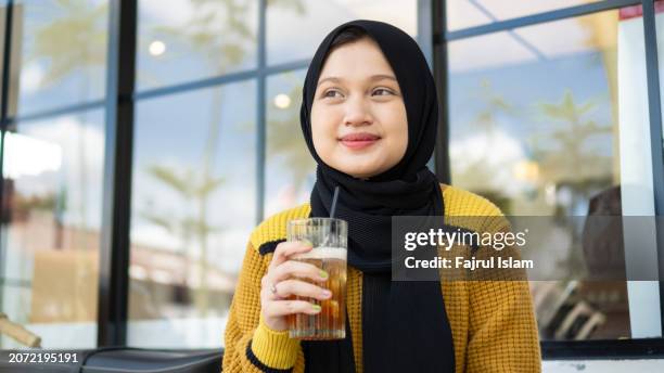 portrait of happy hijab asian young women - fajrul islam stock pictures, royalty-free photos & images
