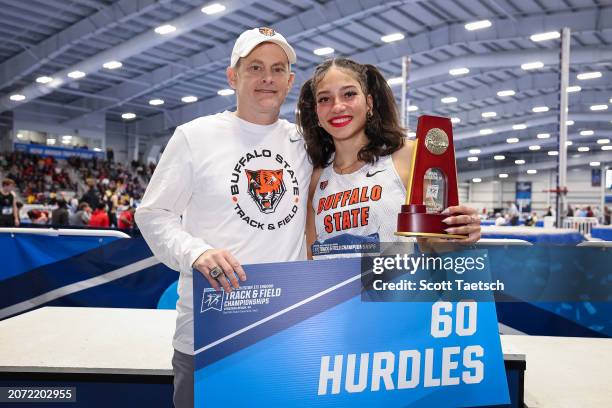 Natalie Sawyer of Buffalo State stand with her coach after winning the womens 60 meter hurdles during the Division III Mens and Women's Indoor Track...