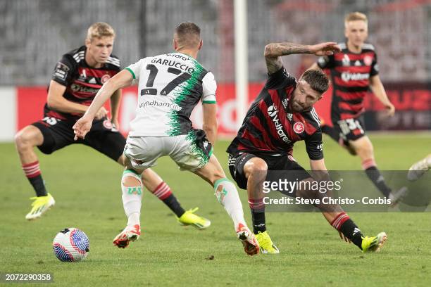 Ben Garuccio of Western United is challenged by Wanderer's Brandon Borrello during the A-League Men round 20 match between Western Sydney Wanderers...