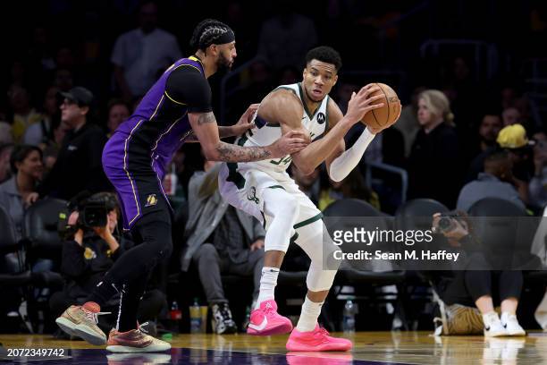 Anthony Davis of the Los Angeles Lakers defends against Giannis Antetokounmpo of the Milwaukee Bucks during the second half of a game at Crypto.com...