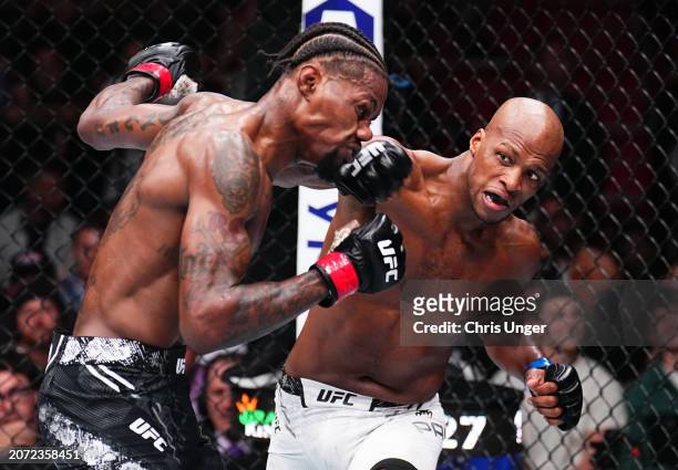 Michael 'Venom' Page of England punches Kevin Holland in a welterweight fight during the UFC 299 event at Kaseya Center on March 09, 2024 in Miami,...