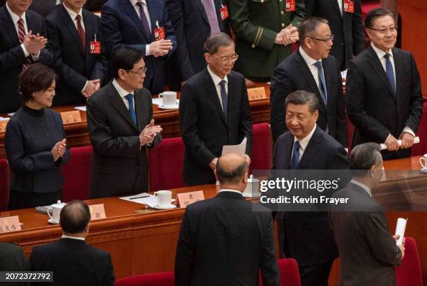 Chinese President Xi Jinping is applauded by delegates at the closing session of the Chinese People's Political Consultative Conference, or CPPCC at...