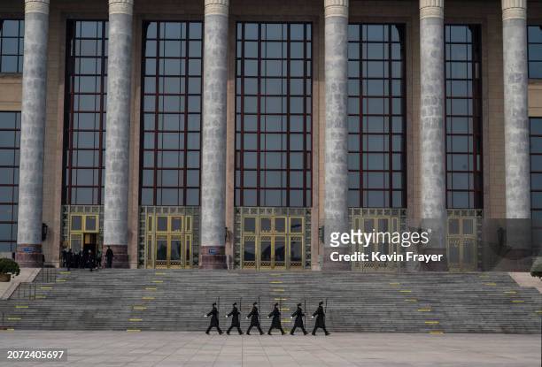 Members the Peoples Armed Polic march together after the closing session of the Chinese People's Political Consultative Conference, or CPPCC at the...
