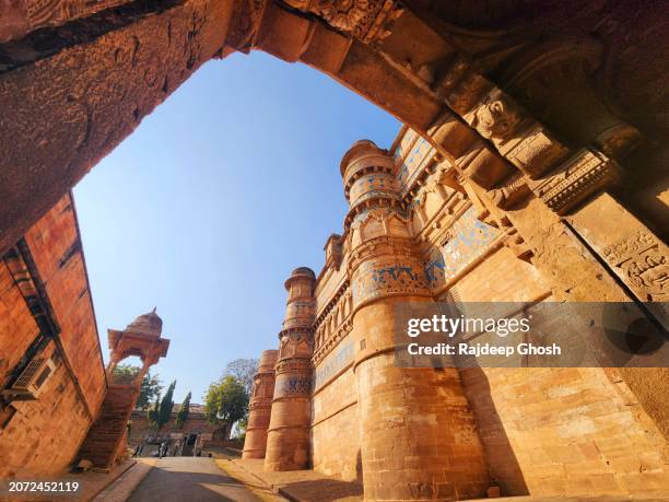 wide angle view of gwalior fort gate - indian tour guide stock pictures, royalty-free photos & images