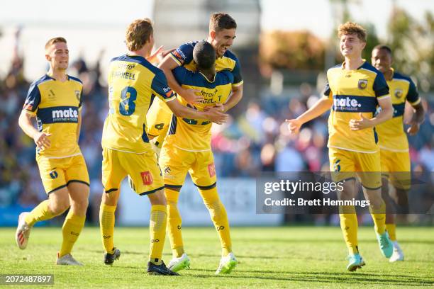 Joshua Nisbet of the Mariners celebrates scoring a goal with team mates during the A-League Men round 20 match between Macarthur FC and Central Coast...