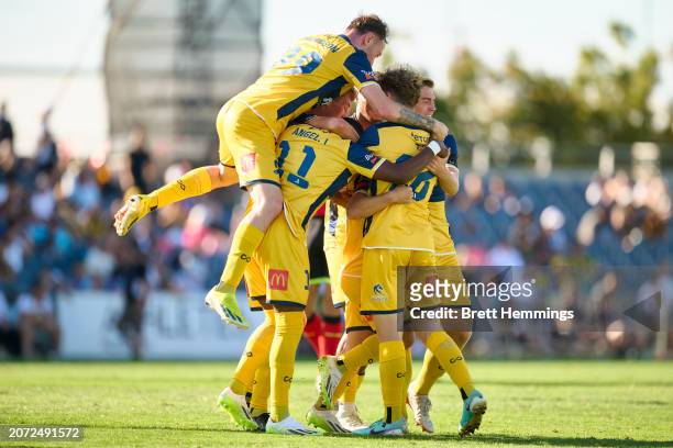 Joshua Nisbet of the Mariners celebrates scoring a goal with team mates during the A-League Men round 20 match between Macarthur FC and Central Coast...