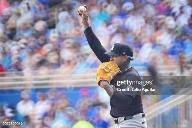 Marcus Stroman of the New York Yankees prepares to deliver a pitch to the Toronto Blue Jays in the first inning during a 2024 Grapefruit League...