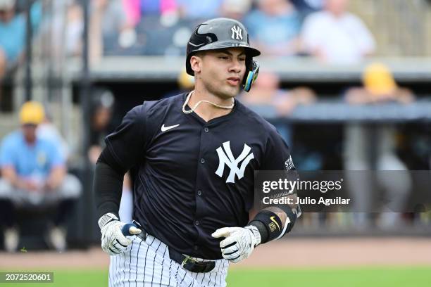 Gleyber Torres of the New York Yankees runs to first after hitting a single in the fourth inning against the Tampa Bay Rays during a 2024 Grapefruit...