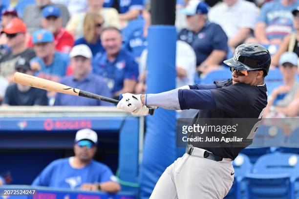 Juan Soto of the New York Yankees hits a foul in the third inning against the Toronto Blue Jays during a 2024 Grapefruit League Spring Training game...