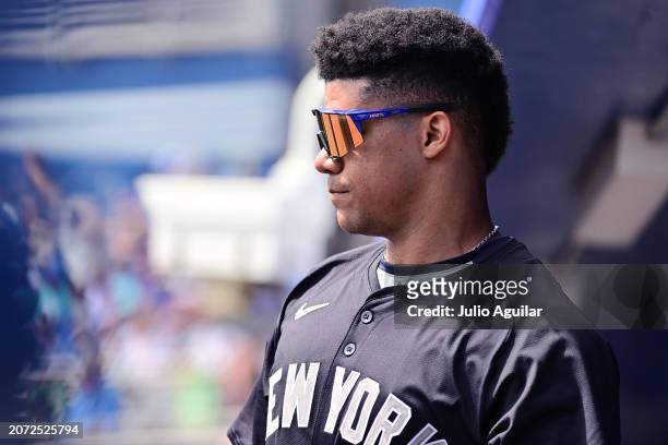 Juan Soto of the New York Yankees looks on from the dugout during a 2024 Grapefruit League Spring Training game against the Toronto Blue Jays at TD...