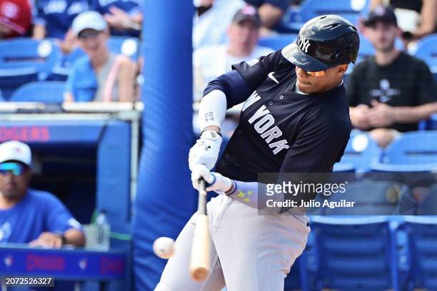 Juan Soto of the New York Yankees hits in the first inning against the Toronto Blue Jays during a 2024 Grapefruit League Spring Training game at TD...