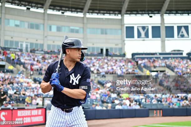 Giancarlo Stanton of the New York Yankees looks on during a 2024 Grapefruit League Spring Training game against the Tampa Bay Rays at George M....
