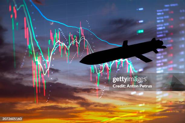 cruise missile on the background of economic charts - shelling stock pictures, royalty-free photos & images