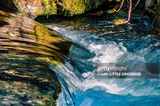 water shapes from a mountain stream - bach stock-fotos und bilder