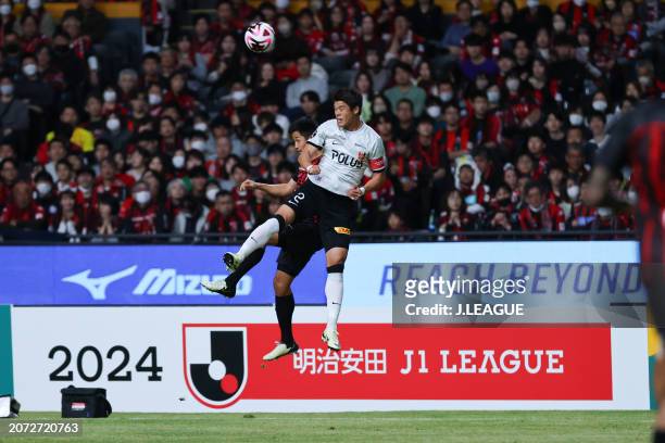 Ryota AOKI of Hokkaido Consadole Sapporo and Hiroki SAKAI of Urawa Reds battle for the ball during the J.LEAGUE MEIJI YASUDA J1 3rd Sec. Match...