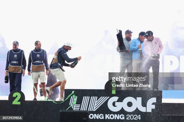 Bryson DeChambeau, Paul Casey, Anirban Lahiri and Charles Howell III of CRUSHERS GC poses with the team trophy after winning the team championship on...