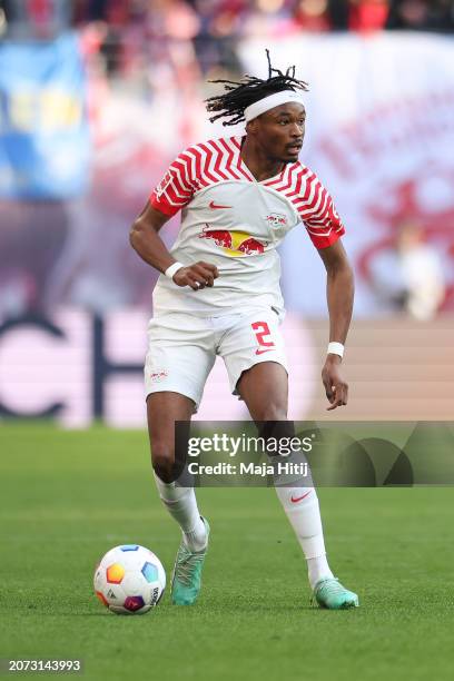 Mohamed Simakan of RB Leipzig controls the ball during the Bundesliga match between RB Leipzig and SV Darmstadt 98 at Red Bull Arena on March 09,...