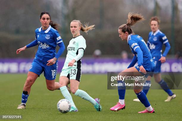 Aggie Beever-Jones of Chelsea passes the ball whilst under pressure from Martina Piemonte and Heather Payne of Everton during the Adobe Women's FA...