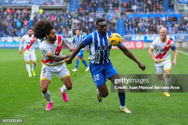 Samu Omorodion of Deportivo Alaves runs with the ball whilst under pressure from Aridane of Rayo Vallecano during the LaLiga EA Sports match between...