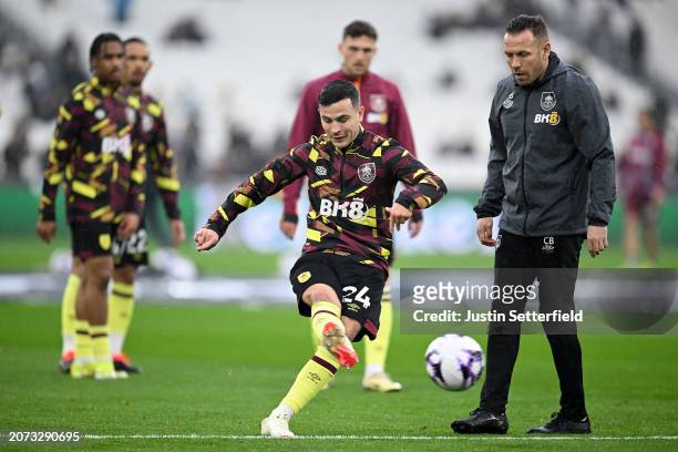 Josh Cullen of Burnley warms up prior to the Premier League match between West Ham United and Burnley FC at the London Stadium on March 10, 2024 in...