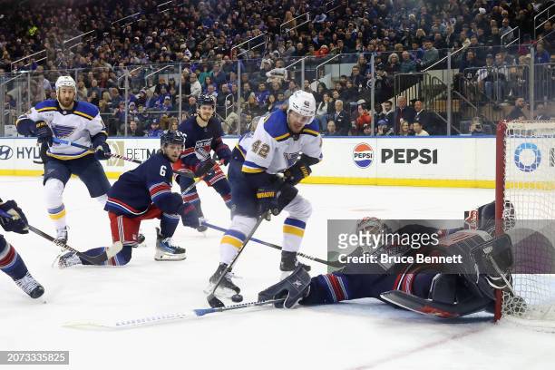 Igor Shesterkin of the New York Rangers makes a third period save against Kasperi Kapanen of the St. Louis Blues at Madison Square Garden on March...