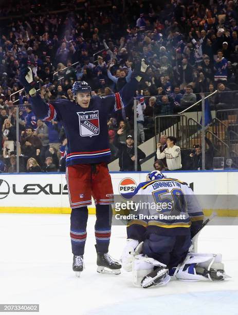 Matt Rempe of the New York Rangers celebrates a first period goal by Jimmy Vesey against the St. Louis Blues at Madison Square Garden on March 09,...