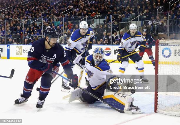 Chris Kreider of the New York Rangers scores against Jordan Binnington of the St. Louis Blues at Madison Square Garden on March 09, 2024 in New York...