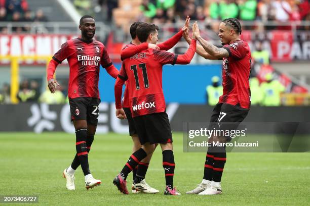 Christian Pulisic of AC Milan celebrates with teammates after scoring his team's first goal during the Serie A TIM match between AC Milan and Empoli...