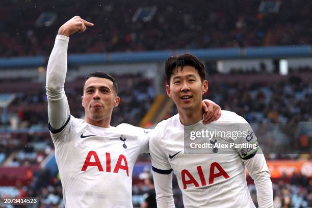 Son Heung-Min of Tottenham Hotspur celebrates scoring his team's third goal with teammate Pedro Porro during the Premier League match between Aston...